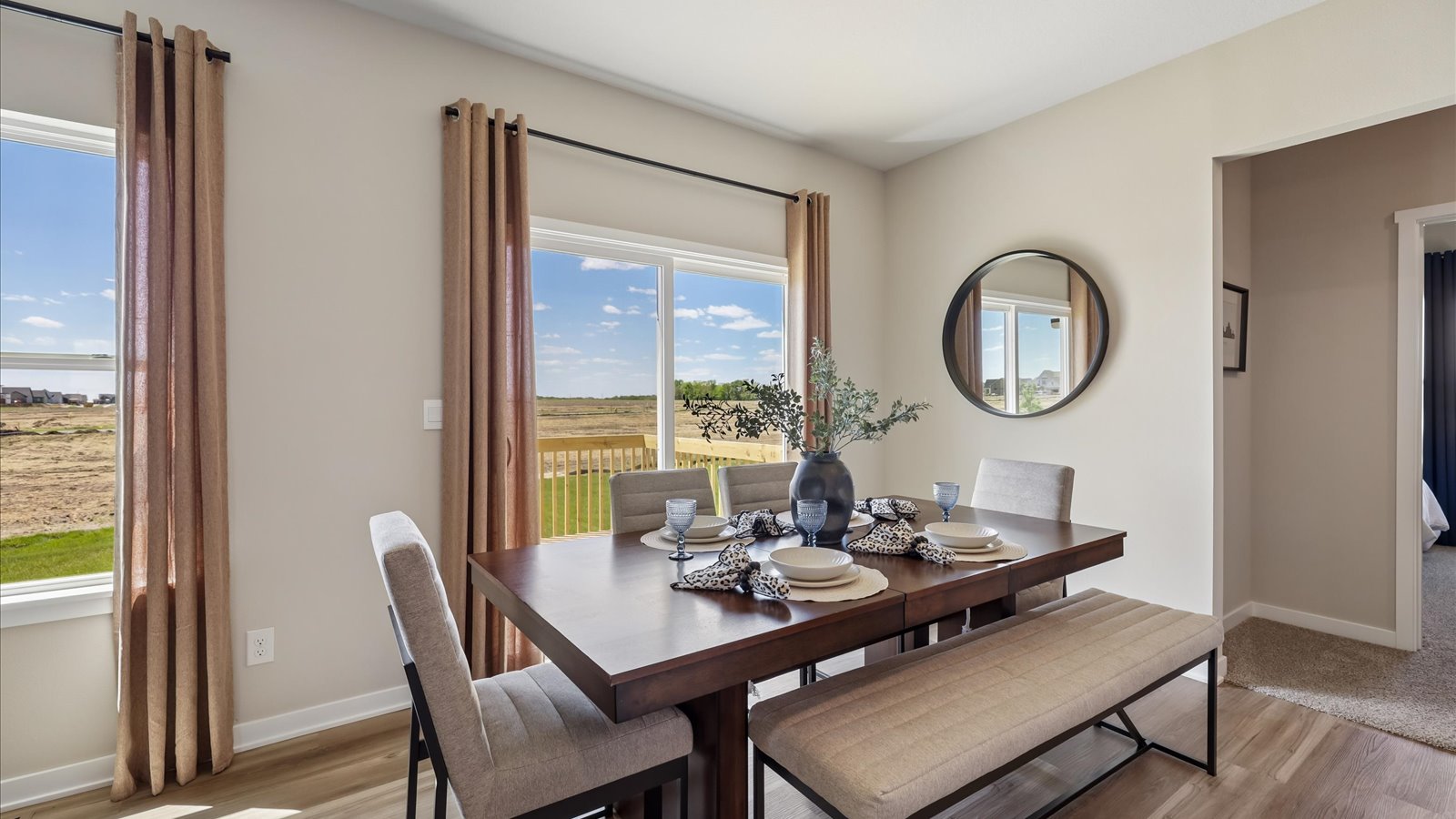 Open concept dining space with access to backyard