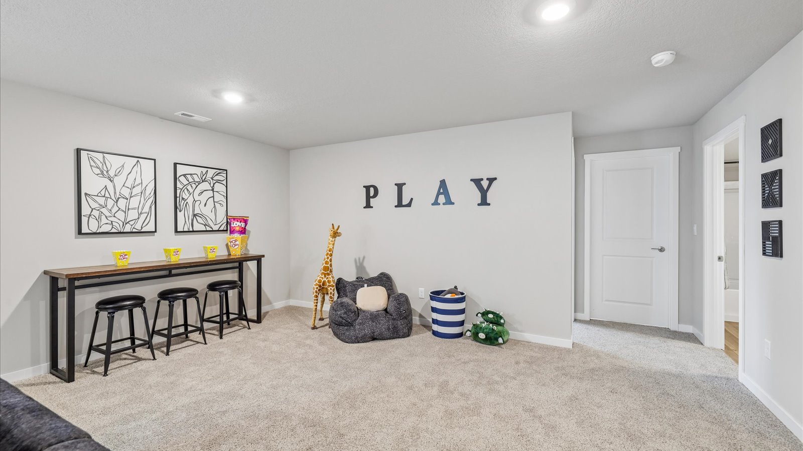 Finished basement living area with comfortable seating space and flexible room for entertaining or relaxing.