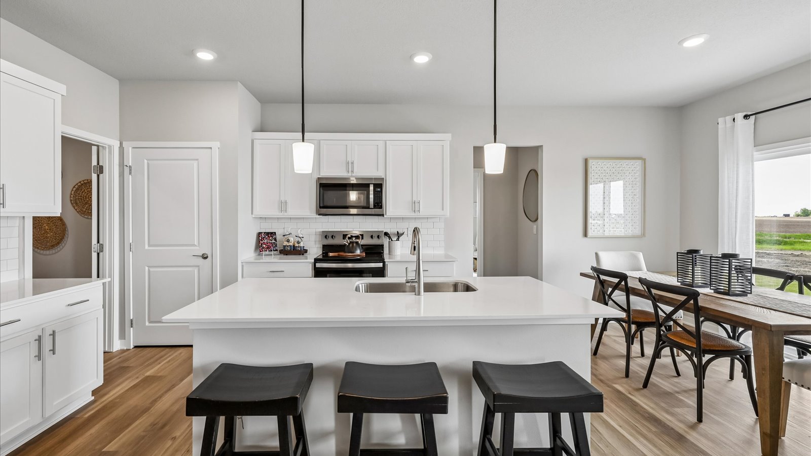Kitchen with white cabinetry and quartz countertop