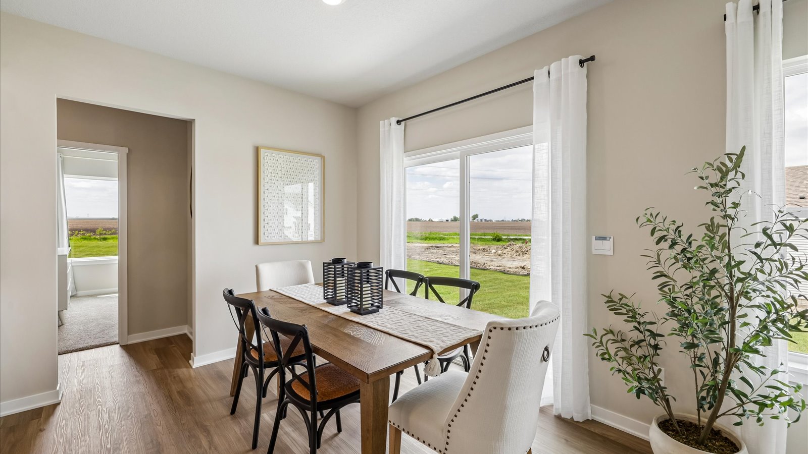 Open concept dining space with access to backyard