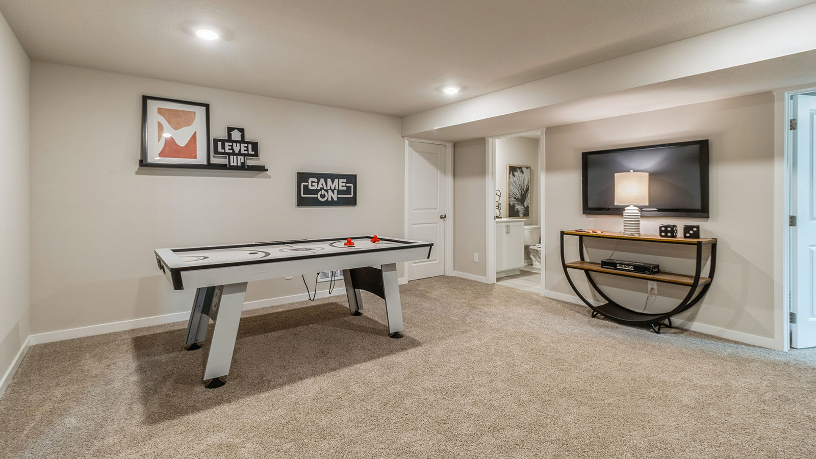 Finished basement living area with comfortable seating space and flexible room for entertaining or relaxing.