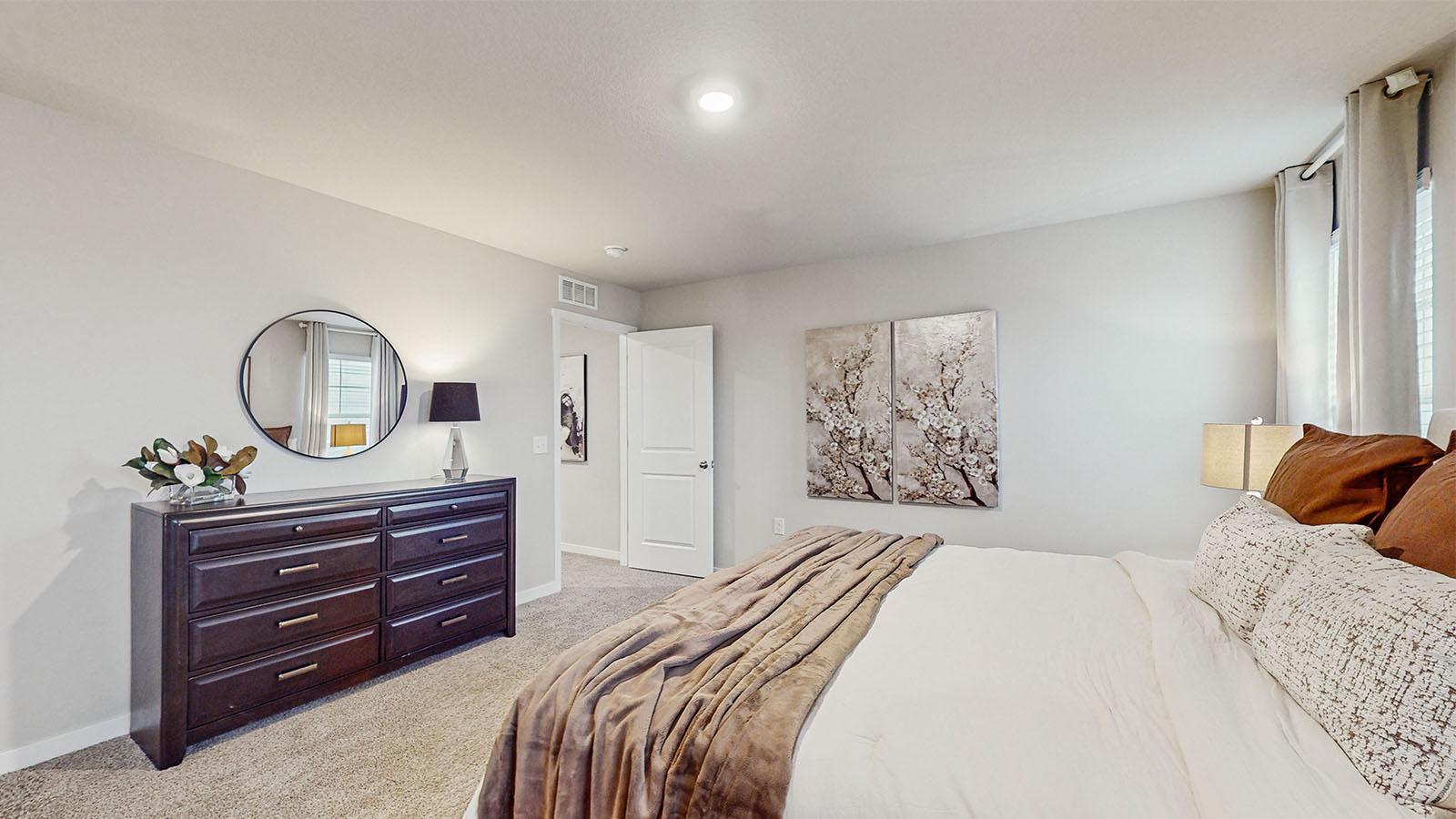 Primary bedroom with natural lighting and spacious layout