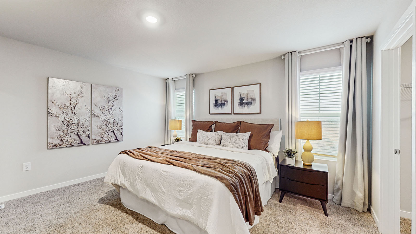 Primary bedroom with natural lighting and spacious layout