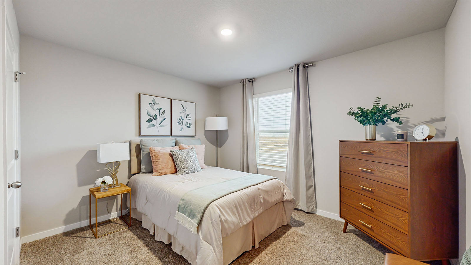 Comfortable secondary bedroom with natural light, modern finishes, and versatile living space.