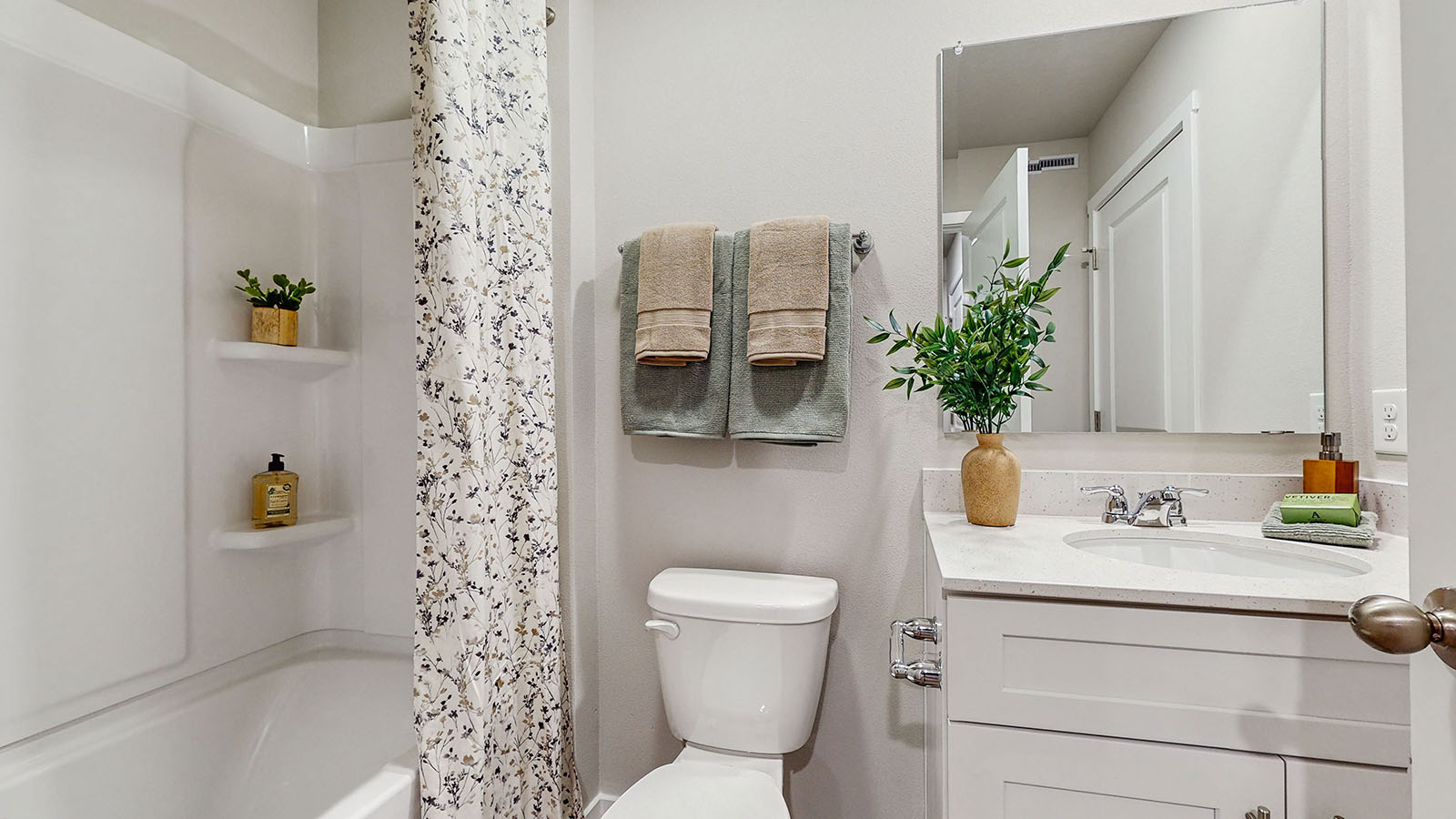 Stylish full bathroom with bright lighting and functional design.