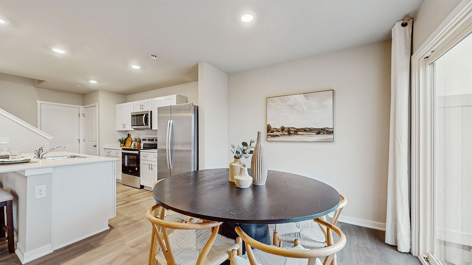 Open concept dining space with access to backyard