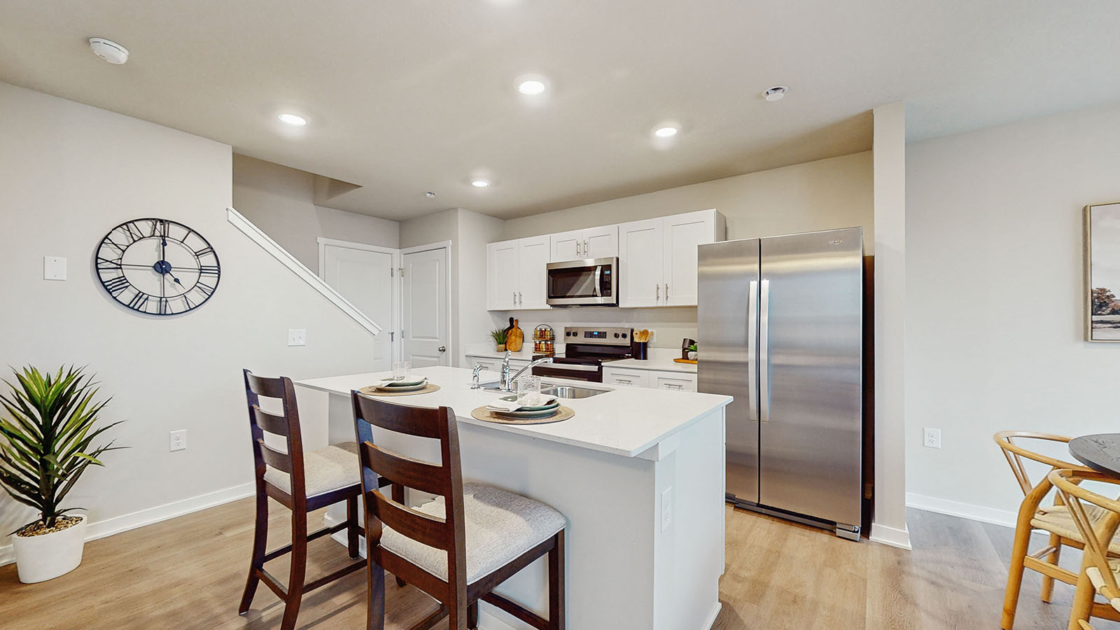 Kitchen with white cabinetry and quartz countertop