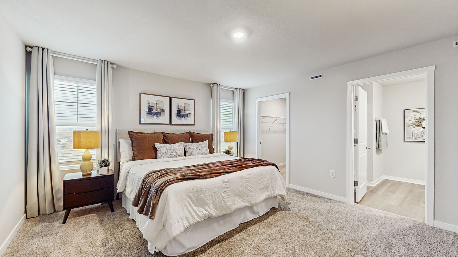 Primary bedroom with natural lighting and spacious layout