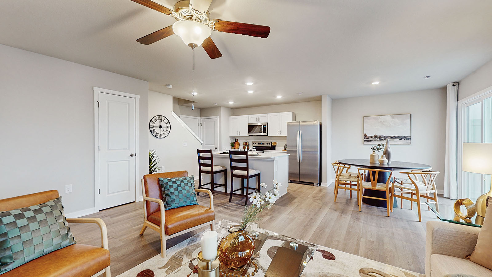 living room with kitchen in background