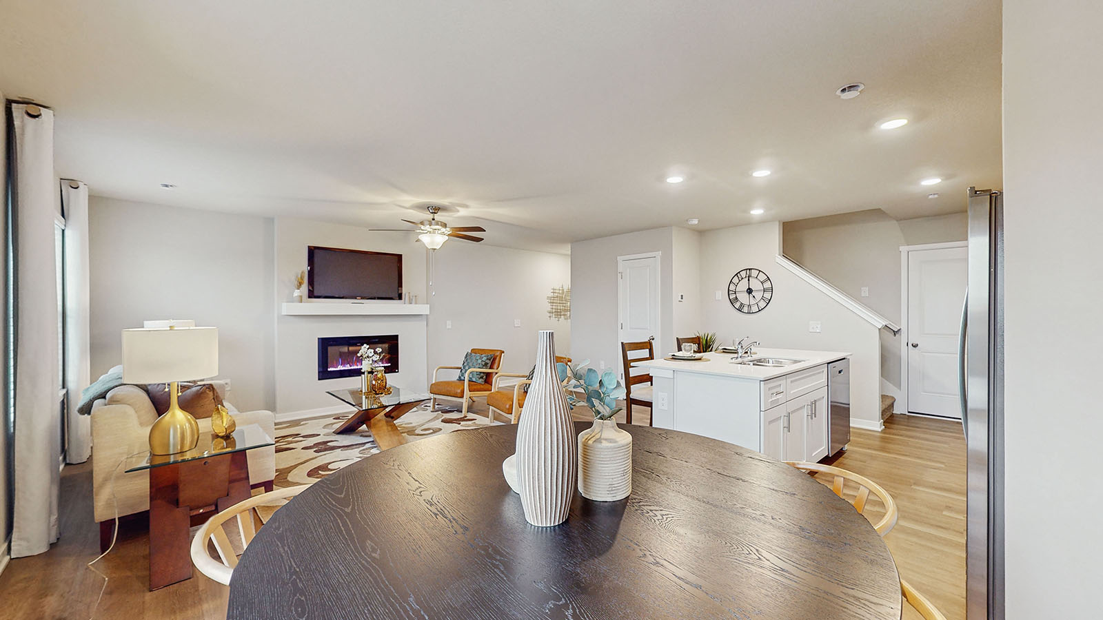 view from dining room of living room and kitchen