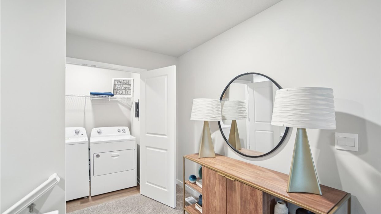 Open landing at the top of the stairs with room for a table and decorative accents.