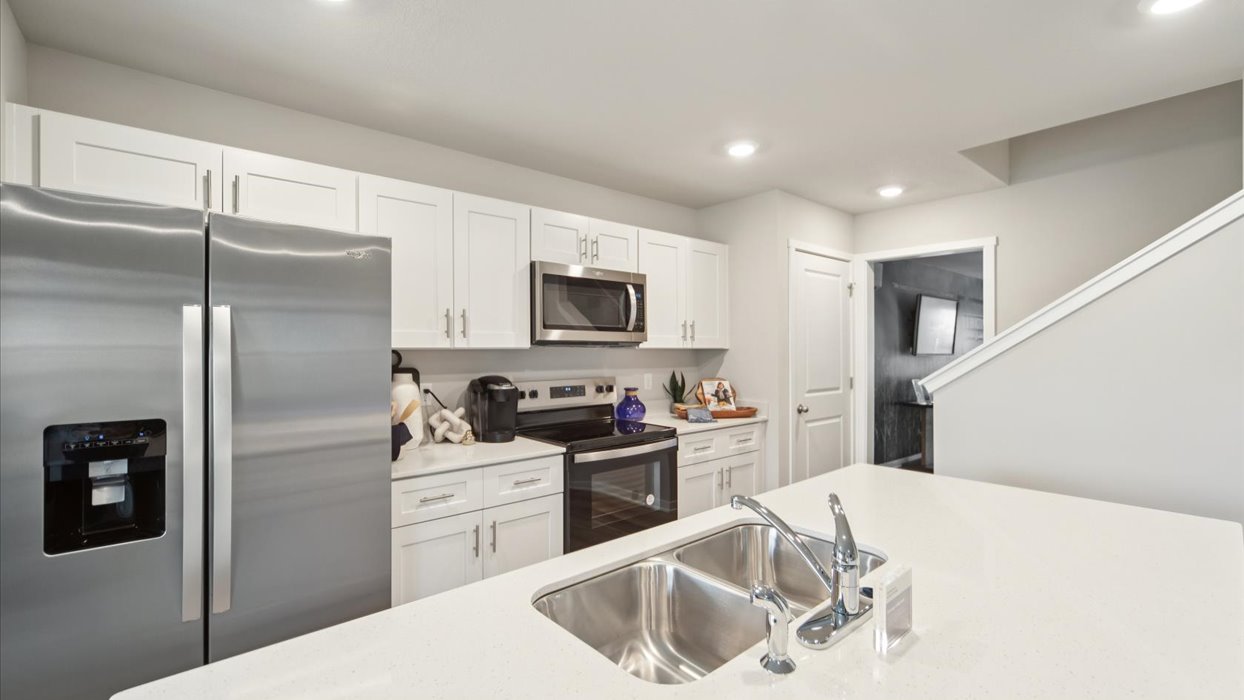Kitchen with white cabinetry and quartz countertop
