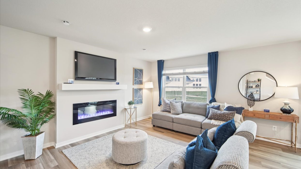 Open concept living room with electric fireplace