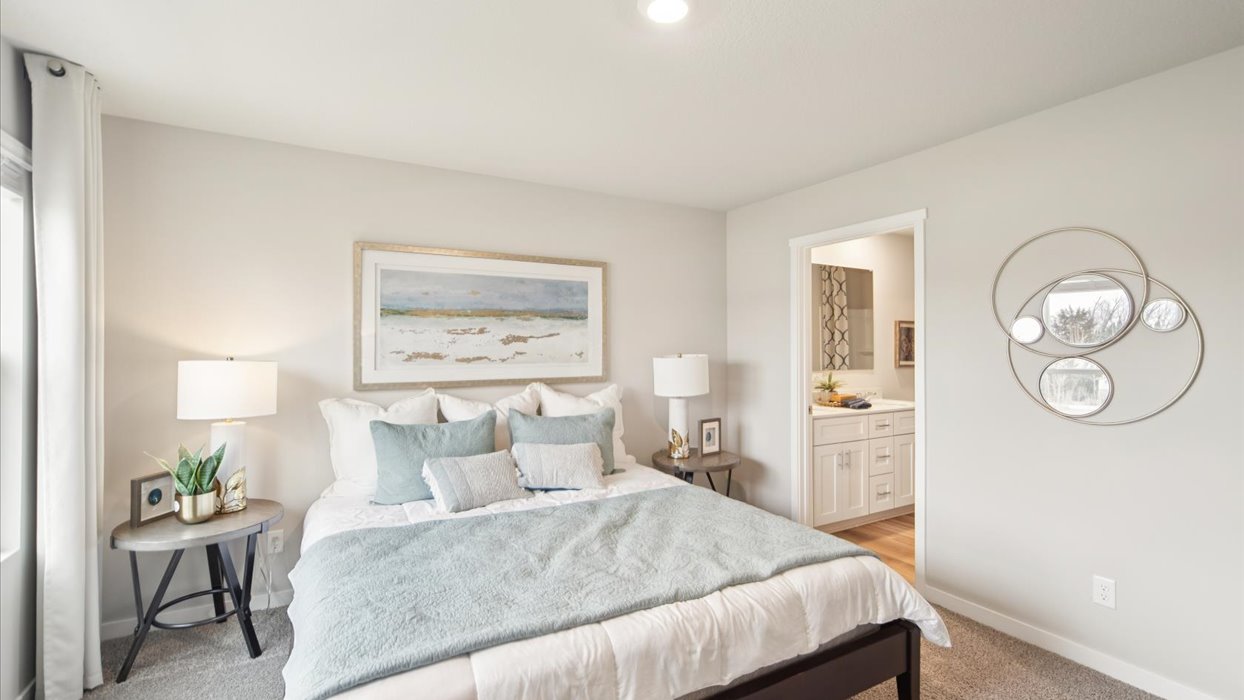 Primary bedroom with natural lighting and spacious layout