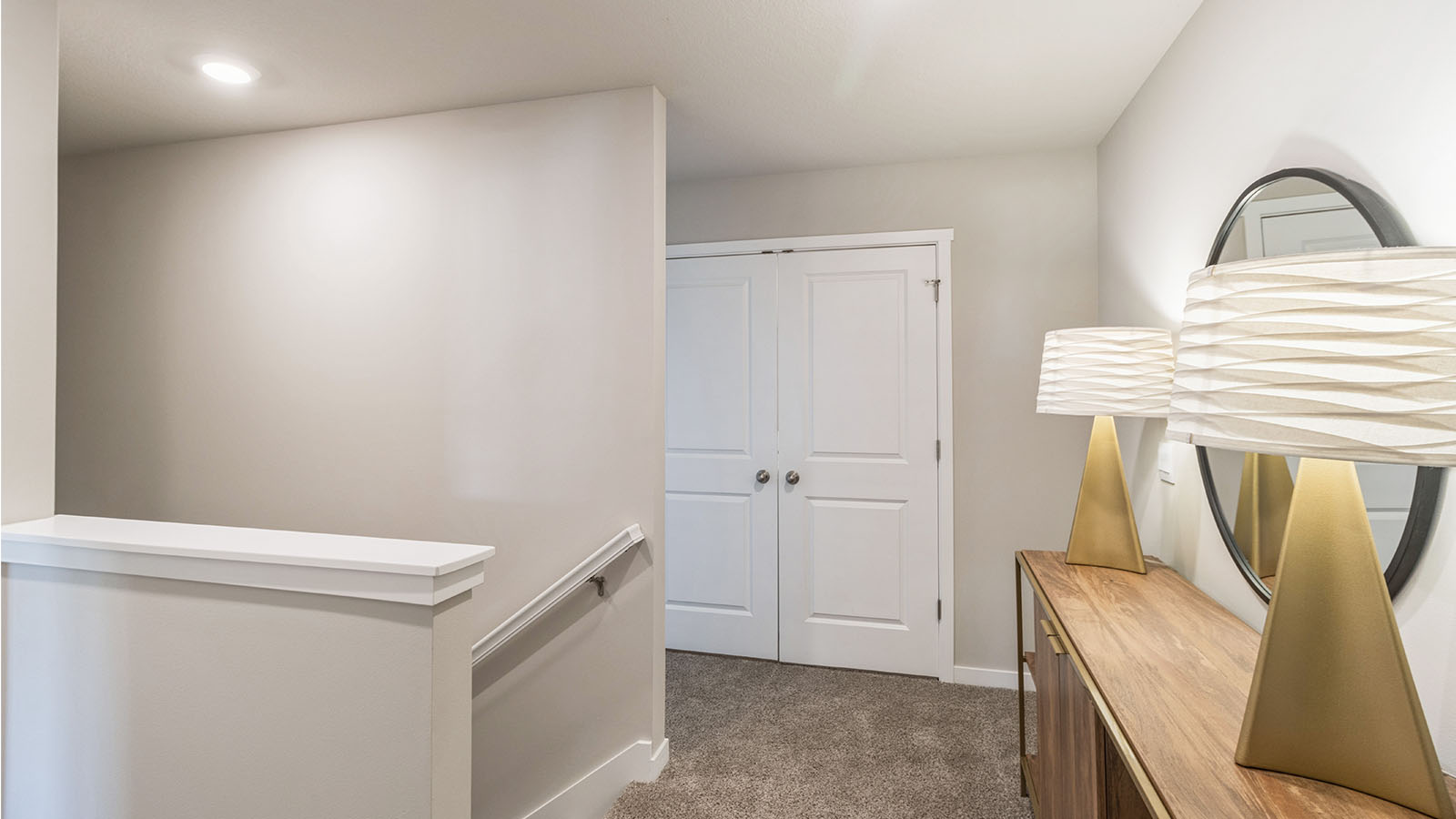 Open landing at the top of the stairs with room for a table and decorative accents.