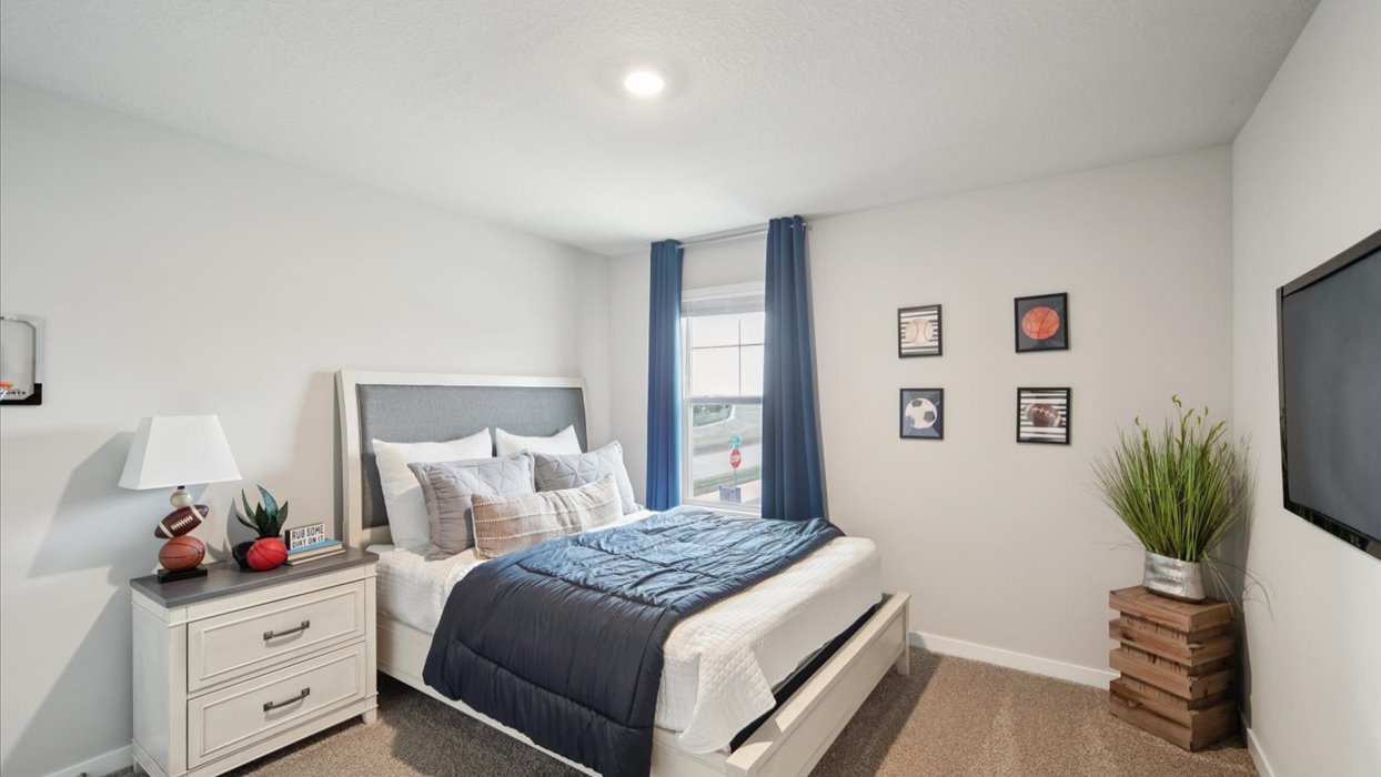 Comfortable secondary bedroom with natural light, modern finishes, and versatile living space.