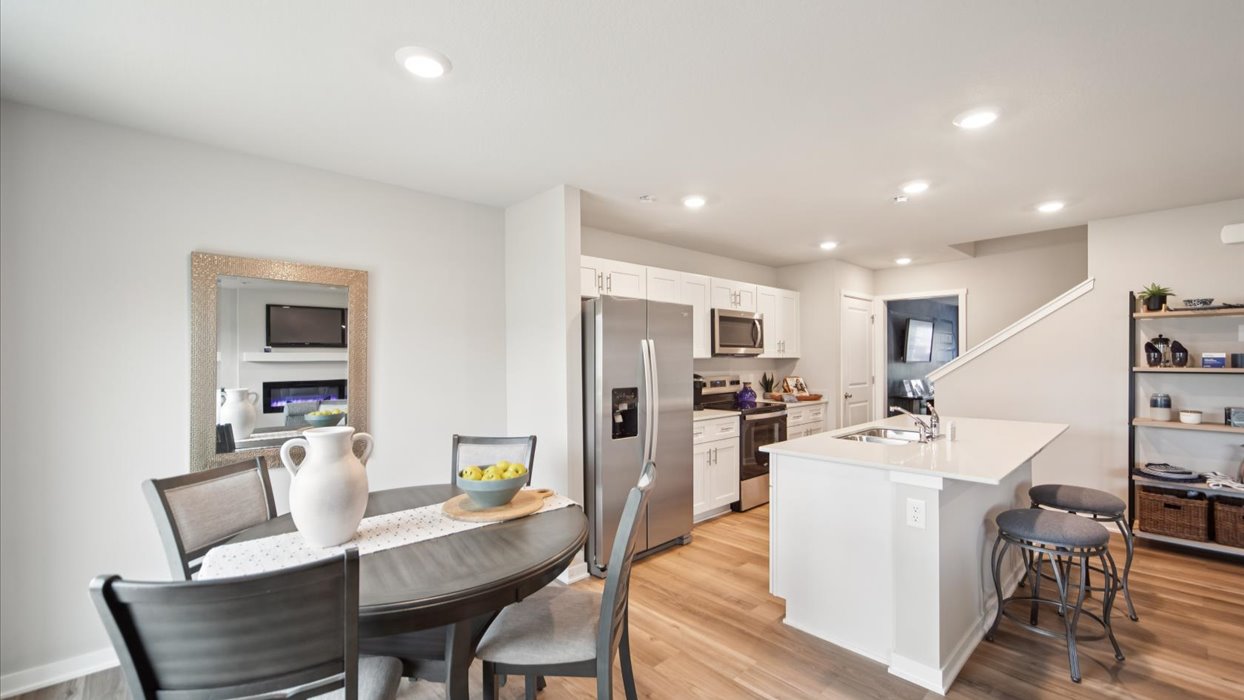 Open concept dining space with access to backyard