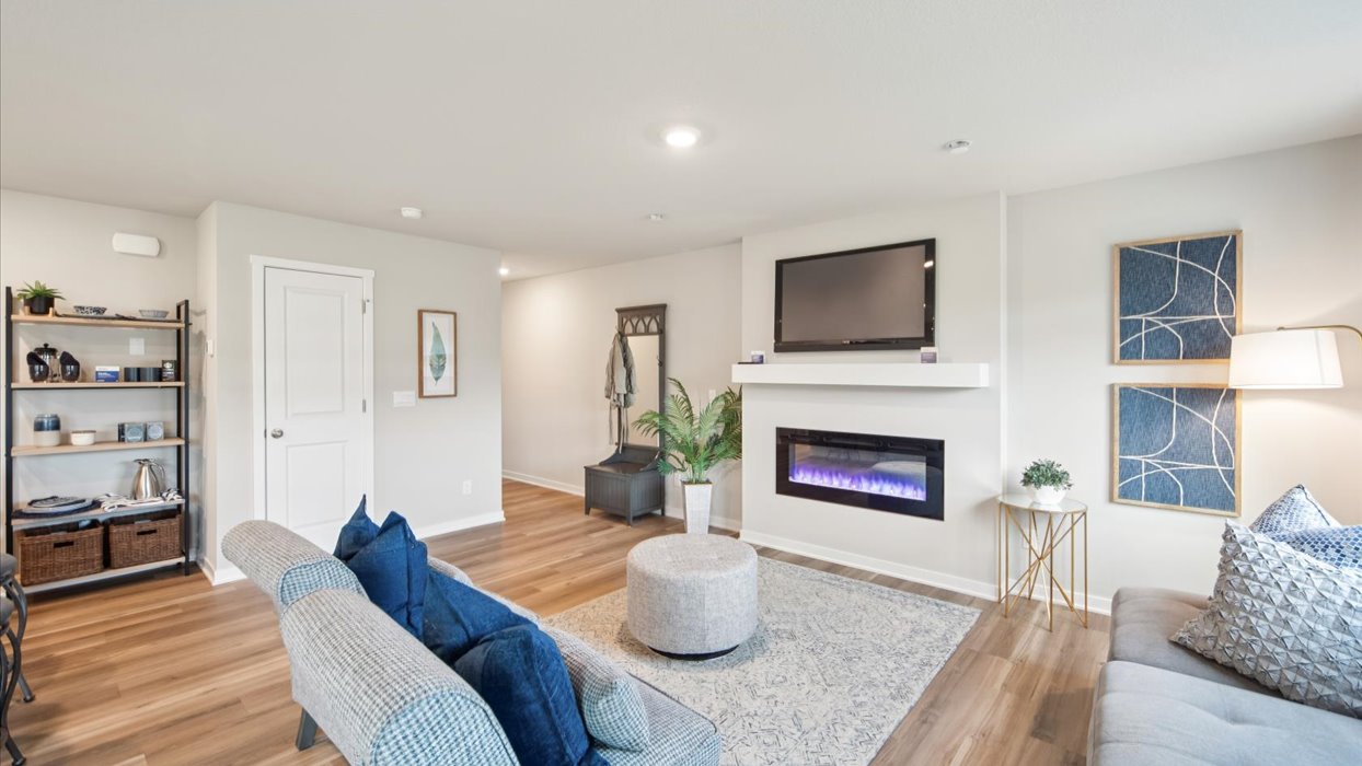Open concept living room with electric fireplace