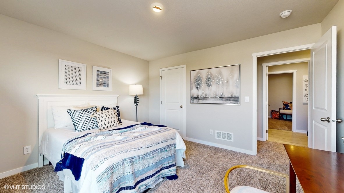 Comfortable secondary bedroom with natural light, modern finishes, and versatile living space.