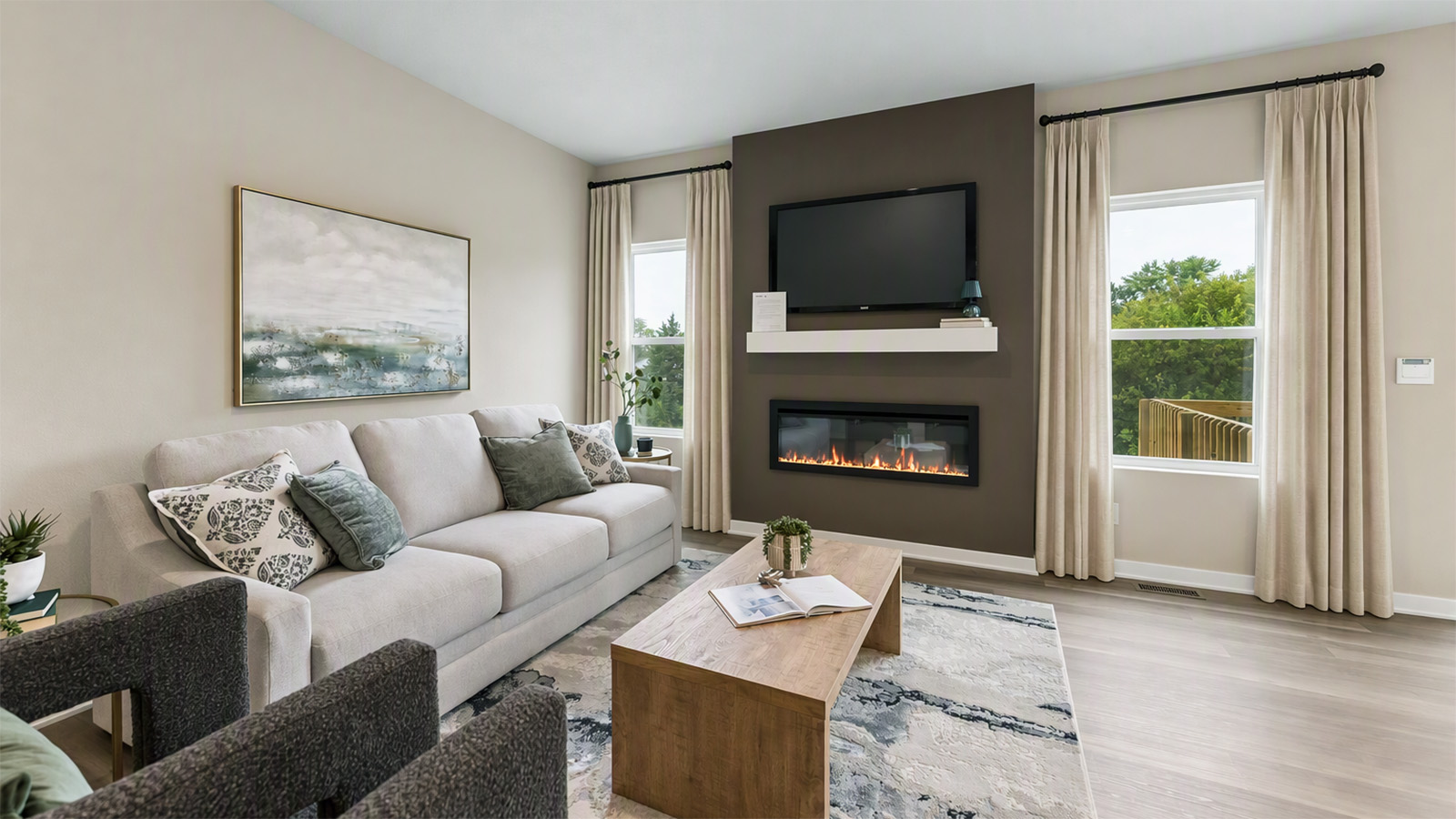 Hamilton living room with large windows and brown accent wall