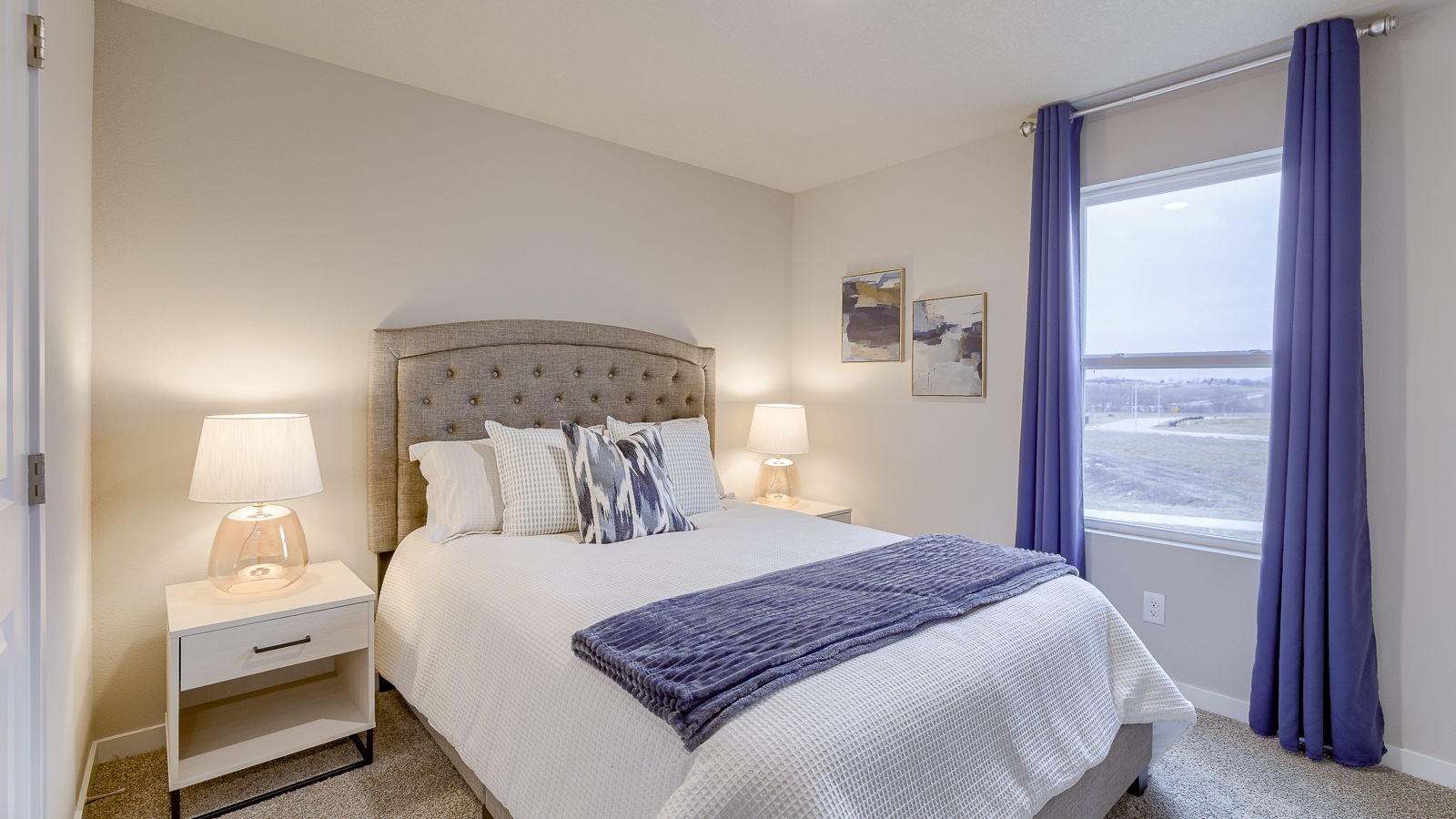 Third bedroom in the Hamilton with a full bed and two white nightstands