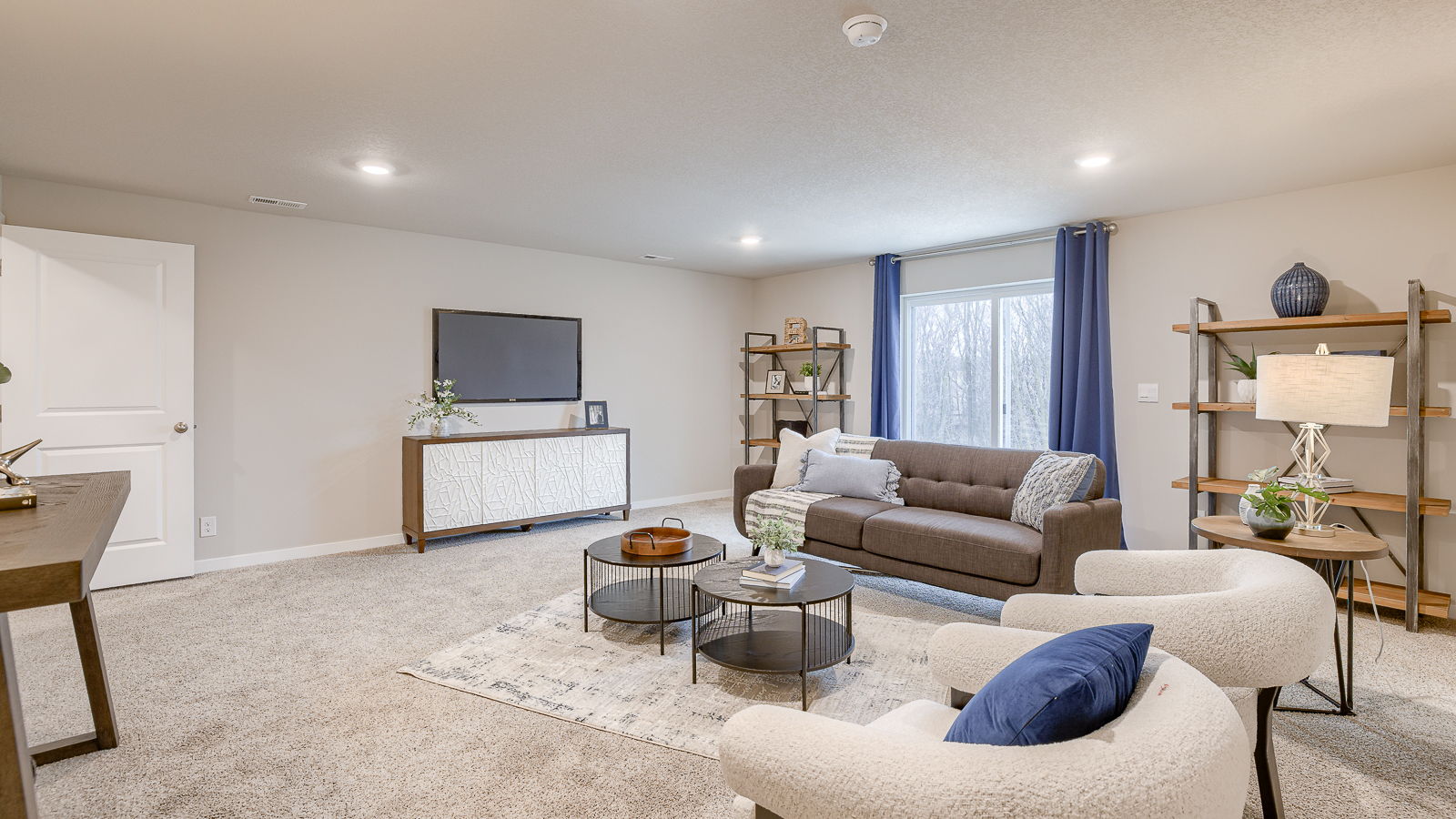 Finished basement living room in the Hamilton with a large entertaining area