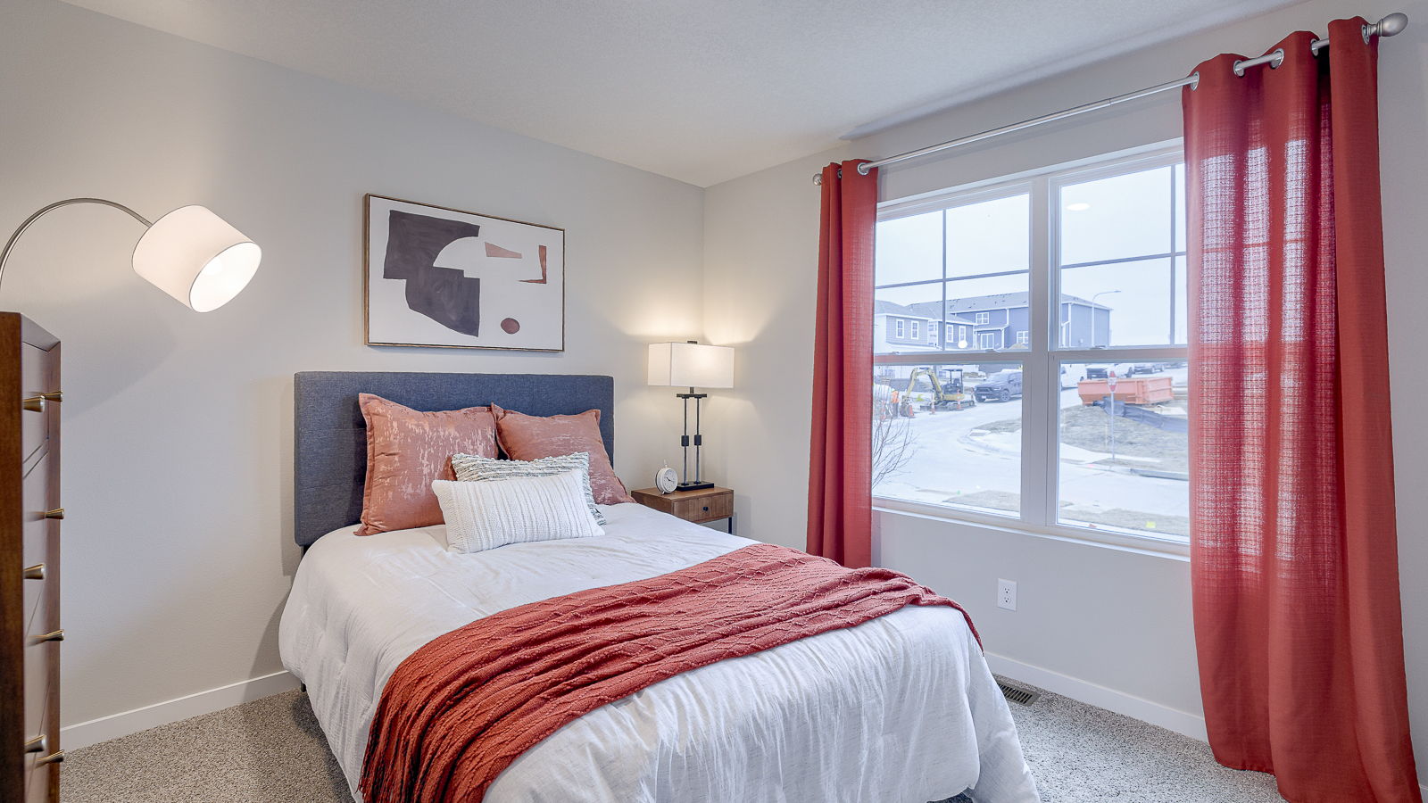 Second bedroom in the Hamilton with a full bed and large window