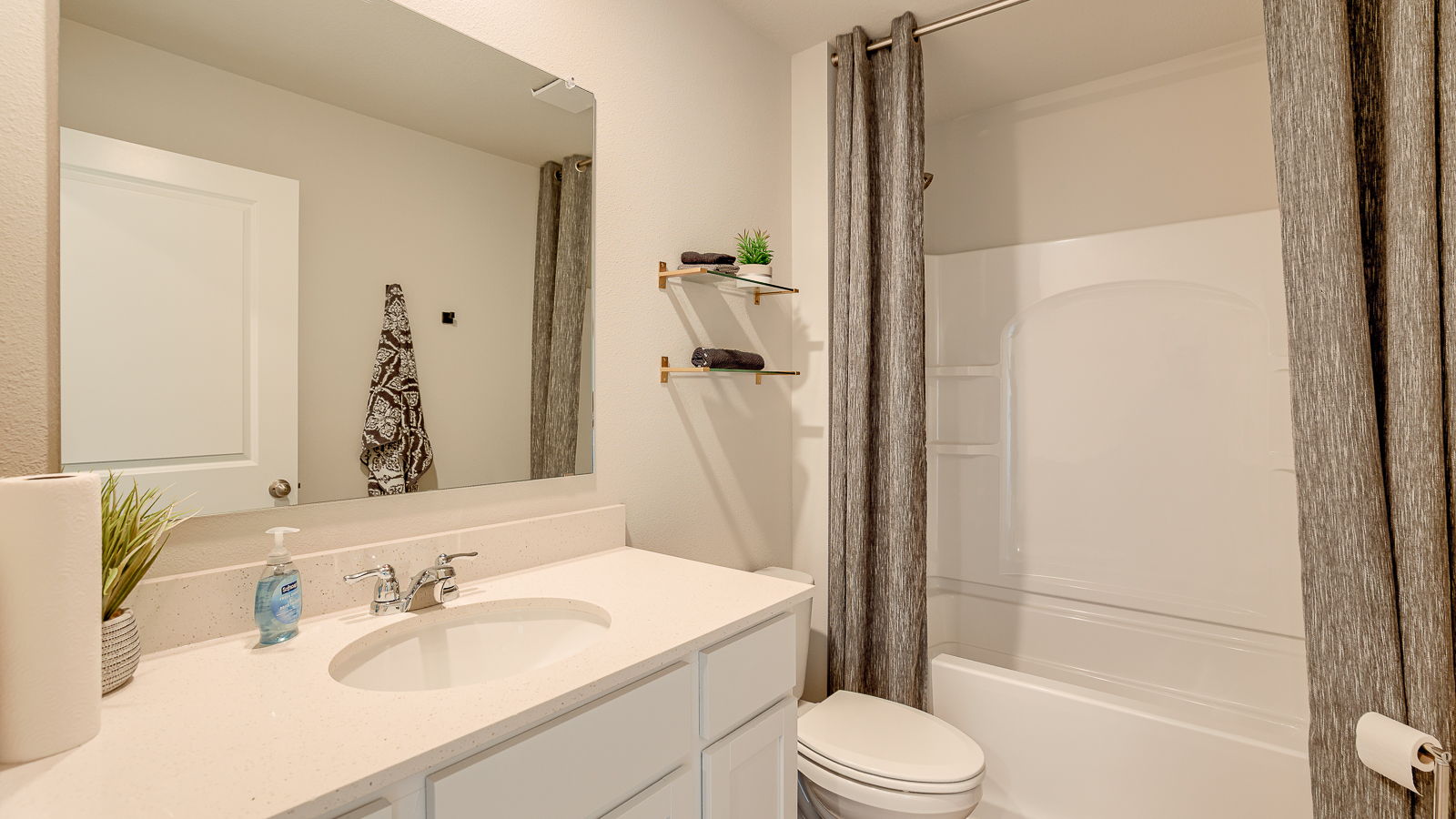 Second bathroom in the Hamilton with sink toilet and tub