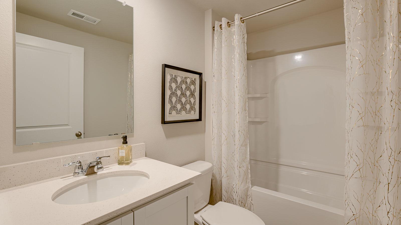 Third bathroom in Hamilton finished basement with sink toilet and tub