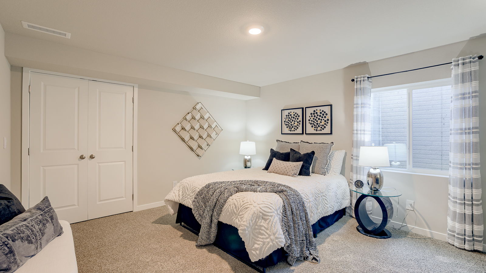 Fourth bedroom in the Hamilton finished basement with french door closet