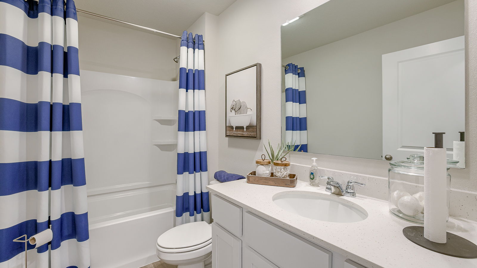 Second full bathroom with a bathtub toilet and sink