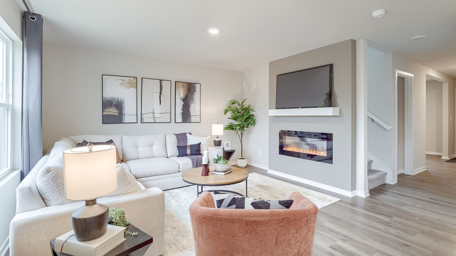 Bellhaven bright living room showcasing electric fireplace and tv shelf