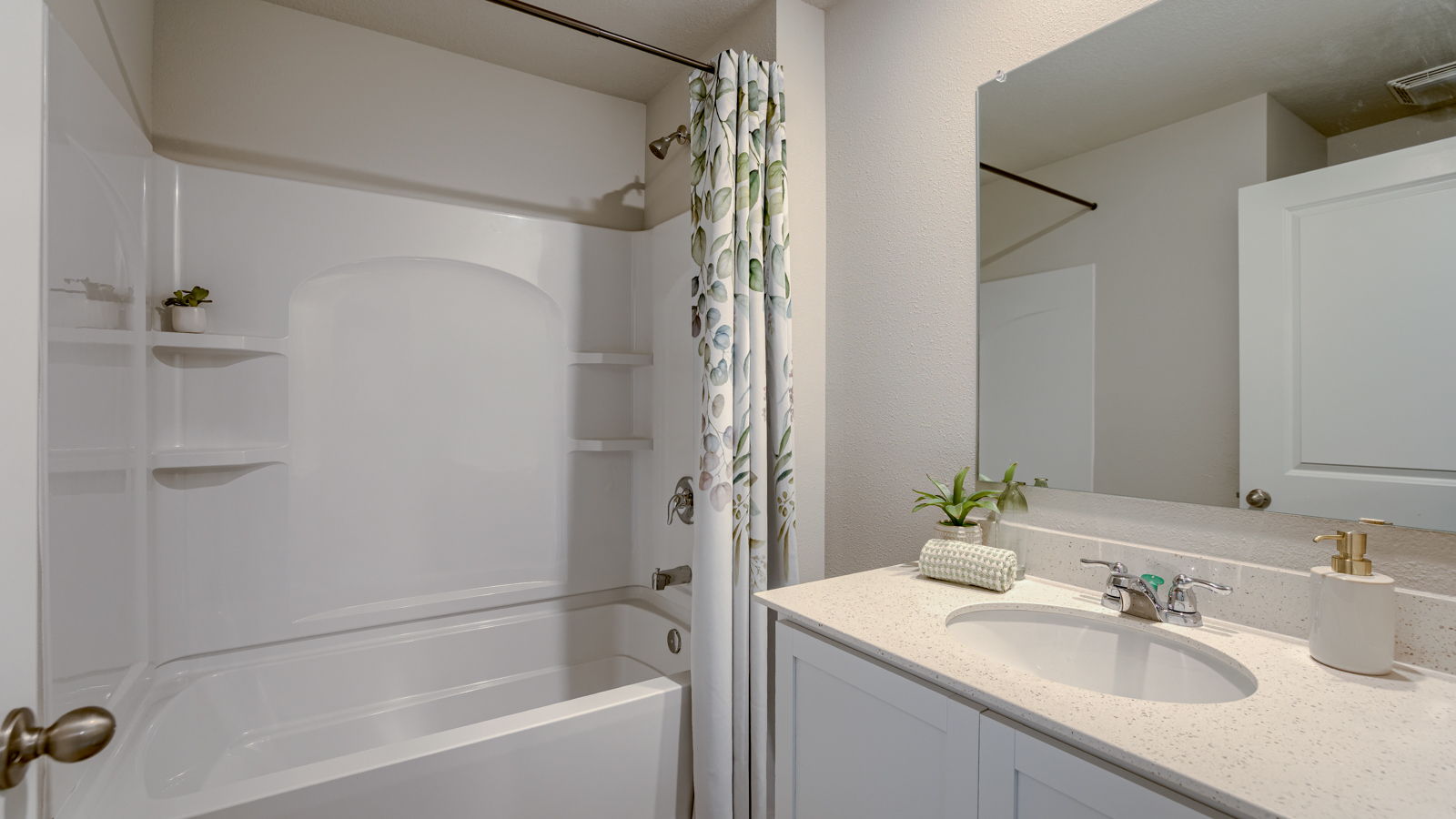 Third bathroom in the finished lower level of the Fremont with a bathtub toilet and sink