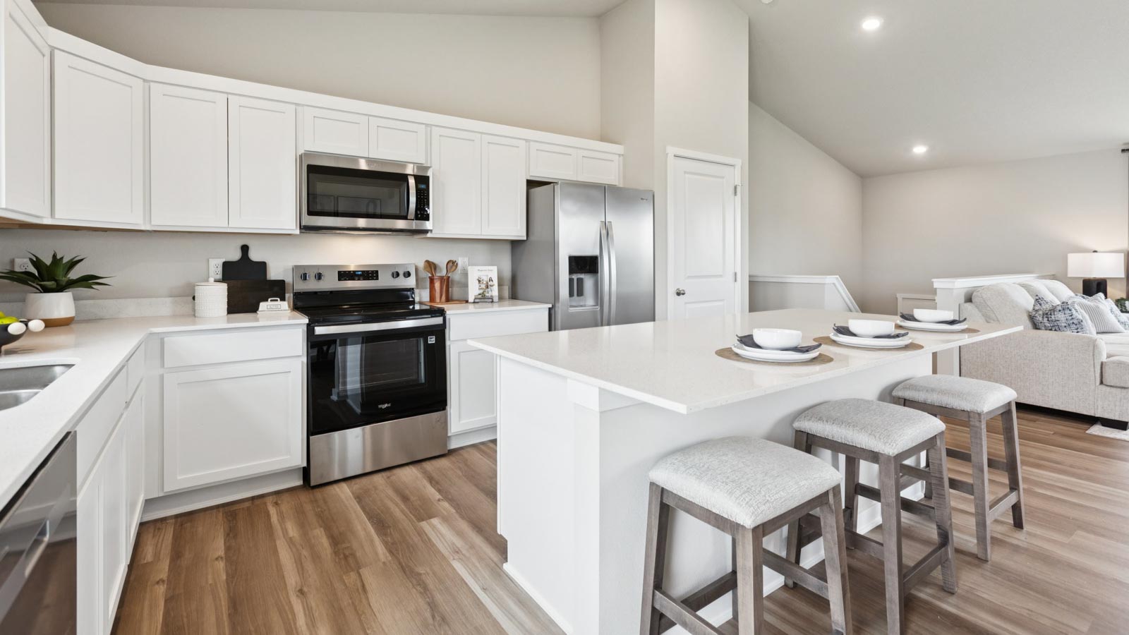 Fremont kitchen showcasing white cabinets and center island