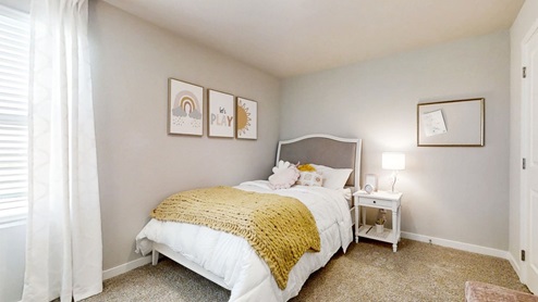 Secondary bedroom in the Sydney staged with a full sized bed