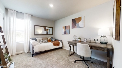 Third bedroom in the Sydney floorplan shown with a daybed and a desk to showcase duality of the space