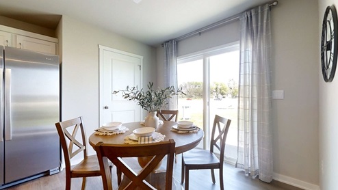 Sydney dining room located near the back patio door