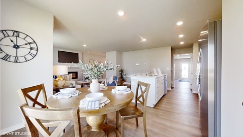 dining room table with 4 chairs looking onto the living room and kitchen in the sydney