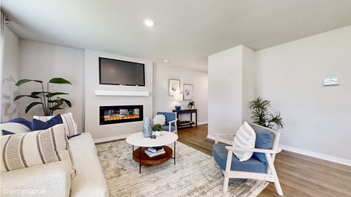 Sydney living room with large couch and featuring built in electric fireplace