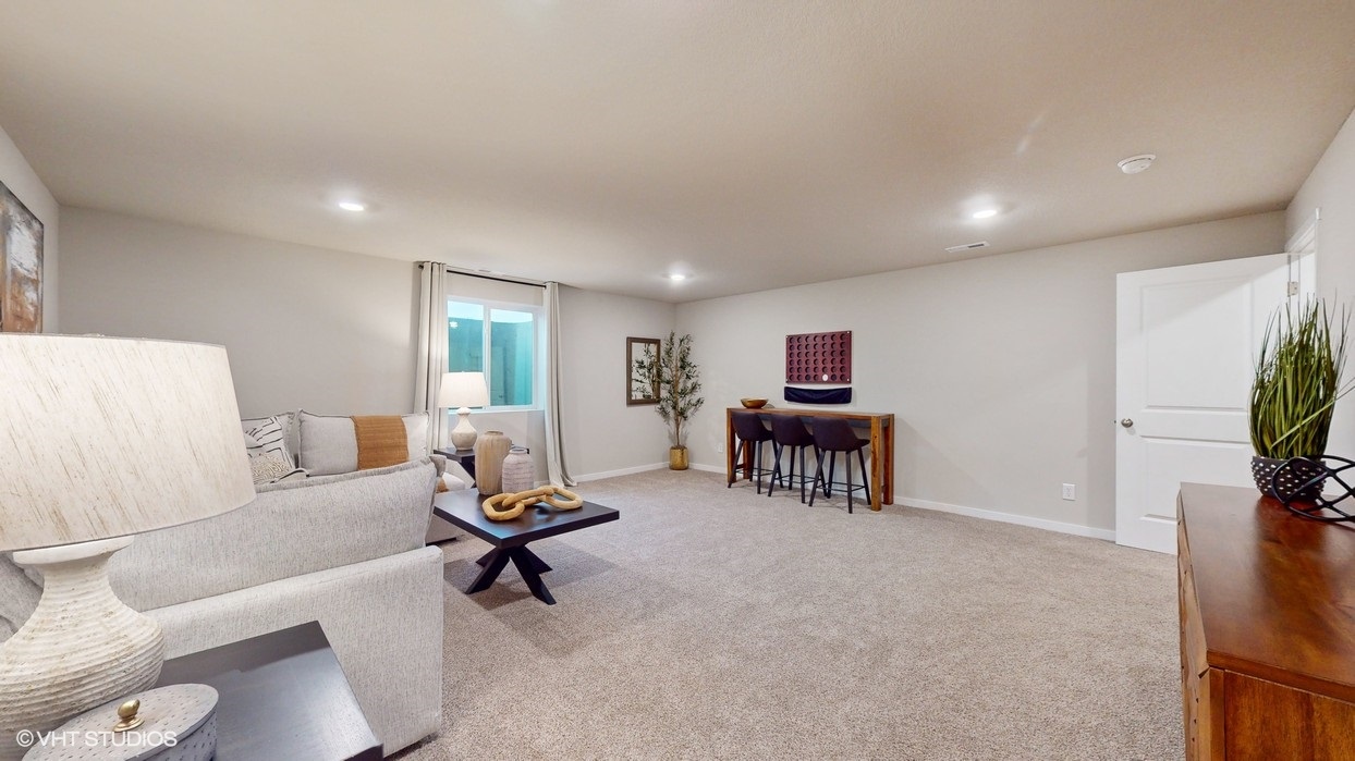 Large finished basement with table and seating area