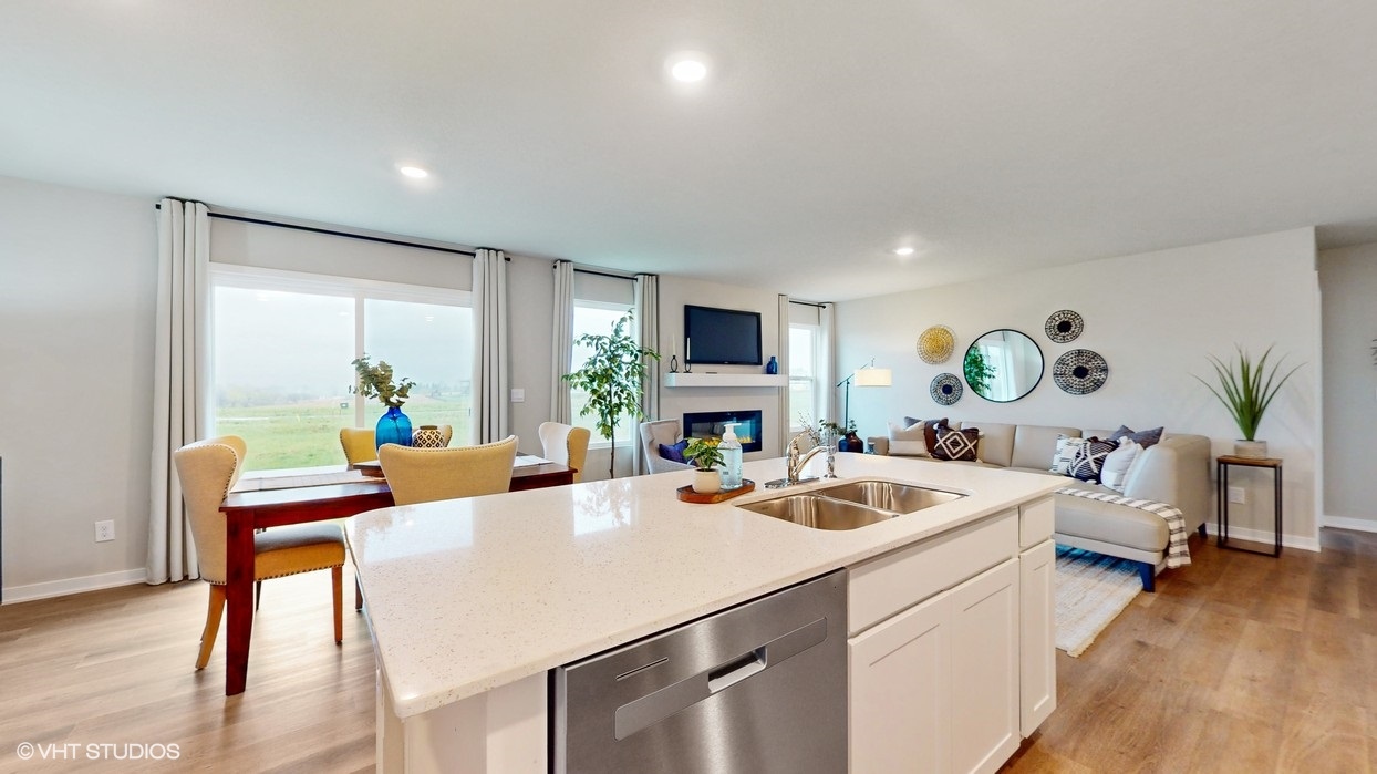Kitchen island overlooking living room with electric fireplace