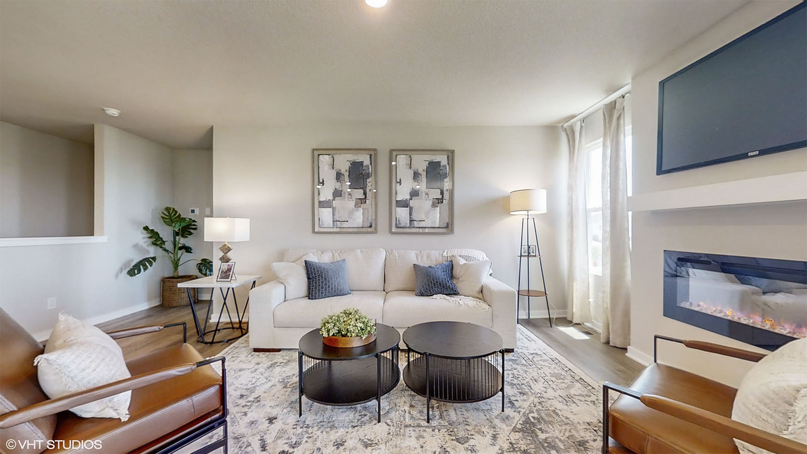 Hamilton living room with a couch and two chairs around a coffee table