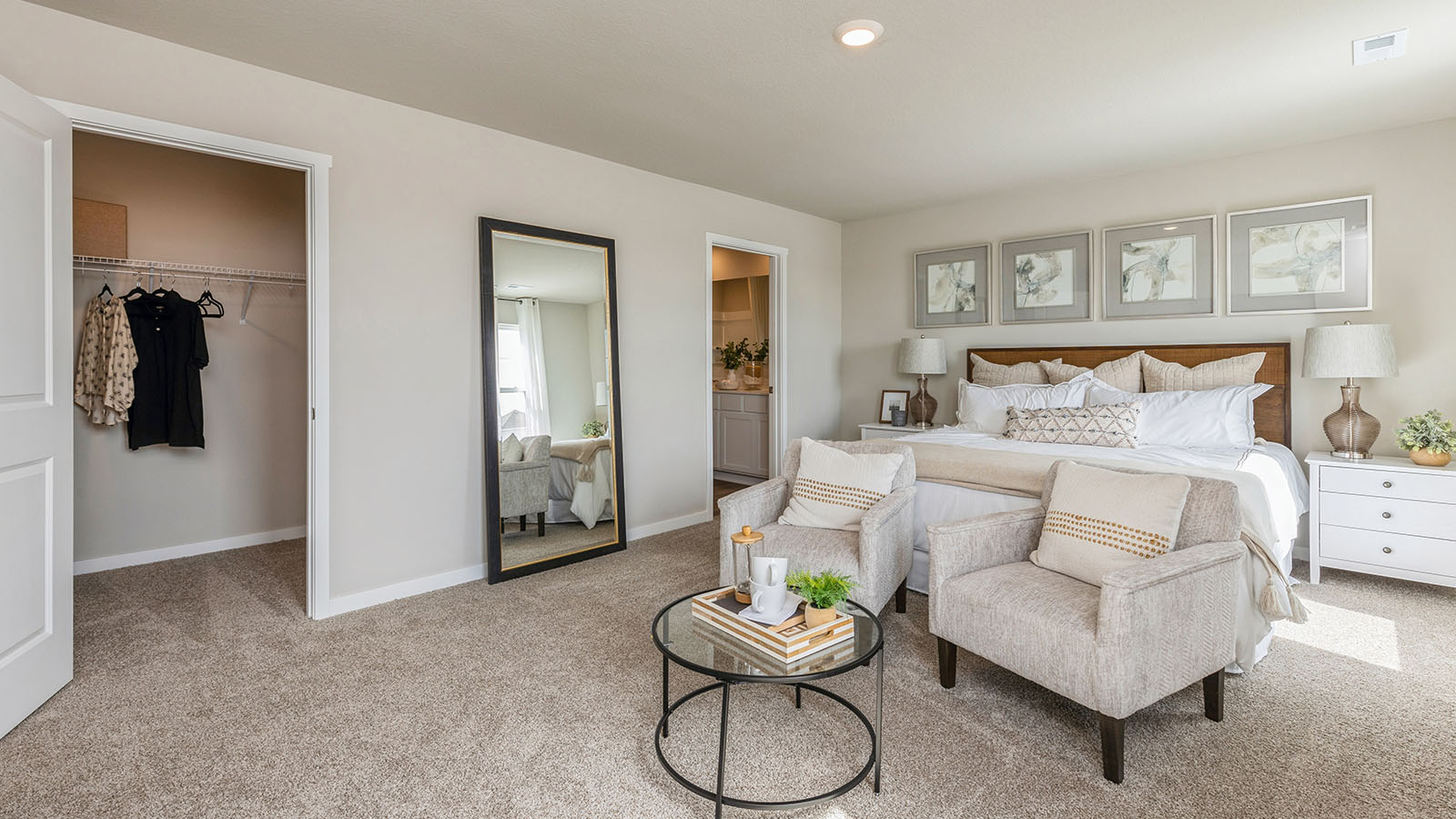 Primary bedroom with view of walk-in closet and primary bathroom