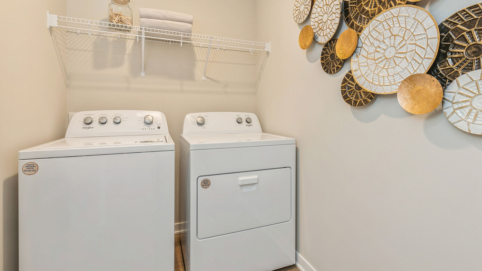 Laundry room with washer and dryer and shelves