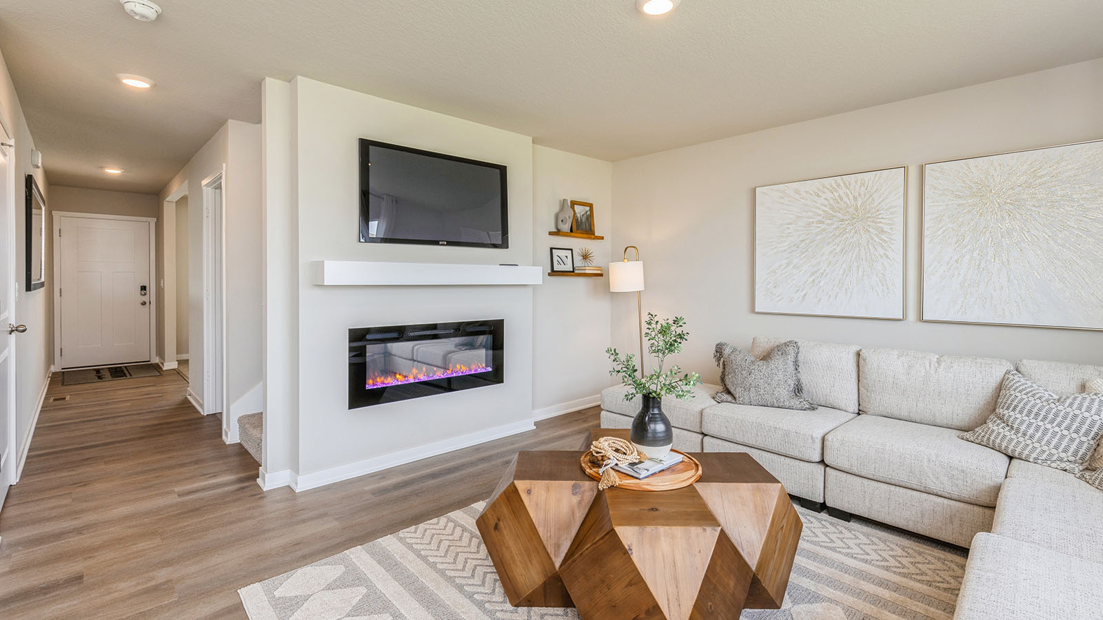 Living room with couch and coffee table and view of front door