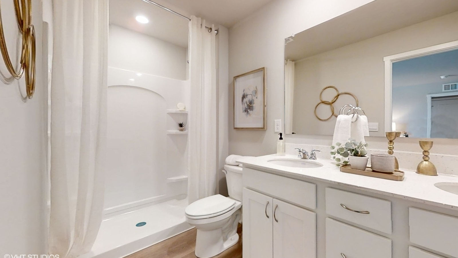 primary bathroom in the Sydney with a walk in shower and white cabinets