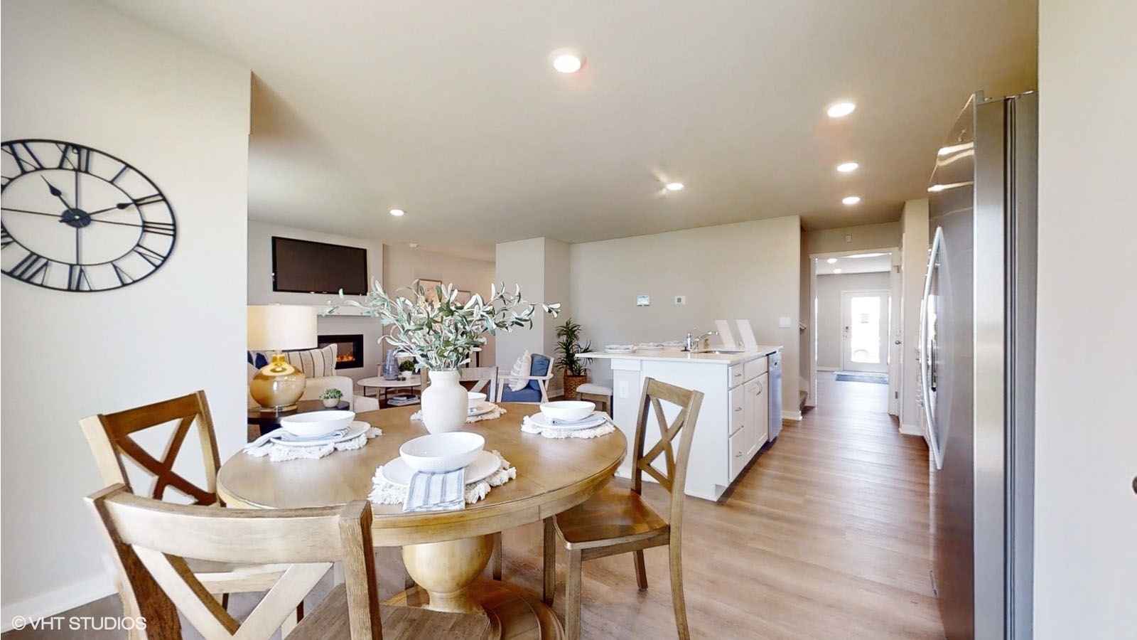 Dining room table with 4 chairs looking onto the living room and kitchen in the Sydney
