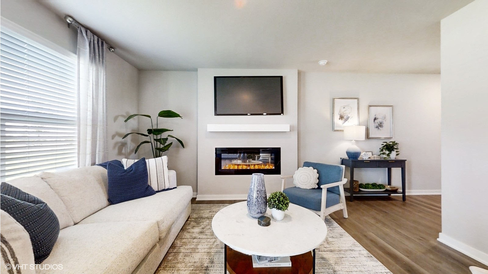 Sydney living room with couch and chairs with fireplace