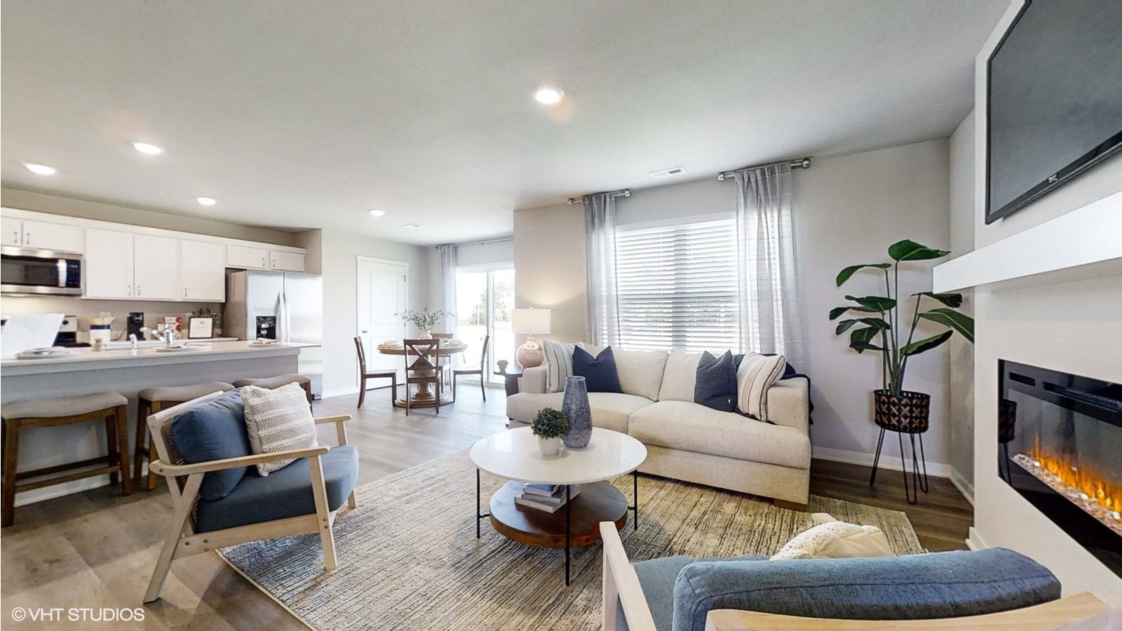 view of the living room in the sydney looking into the kitchen and dining room