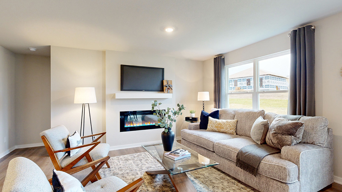 Roland living room with grey couch and two chairs